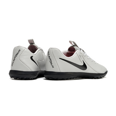 Chuteira Society TF Nike Phantom GX2 Academy Pack Rising Gem