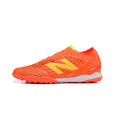 Chuteira Society TF New Balance Tekela Elite V5 Laranja
