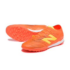 Chuteira Society TF New Balance Tekela Elite V5 Laranja